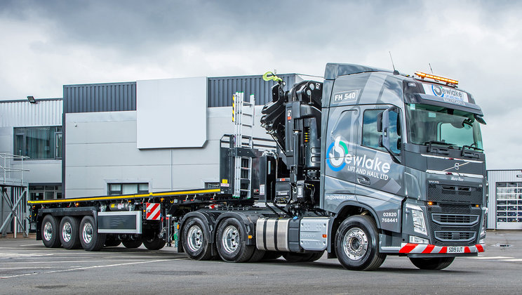 County Antrim based, Bewlake Lift and Haul Ltd is a new-start business that has selected a crane-equipped Volvo FH tractor unit, coupled to an SDC trailer, to launch its operations.)