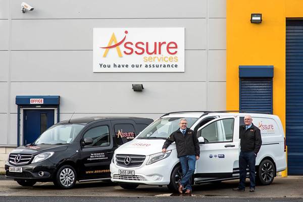 Assure Services Managing Director Damien Martin, left, and Sales Manager Adrian Maguire, with their smart Mercedes-Benz vans)